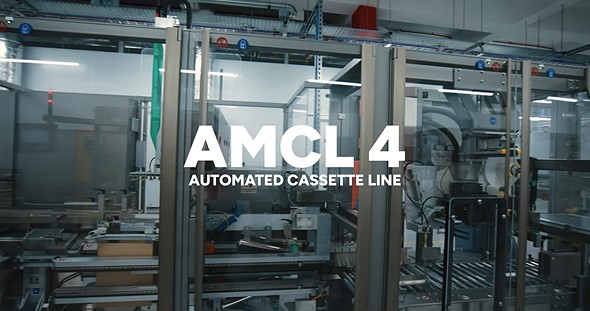 white text is over an image of factory equipment