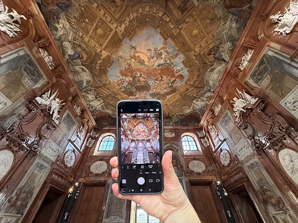 phone in hand taking picture