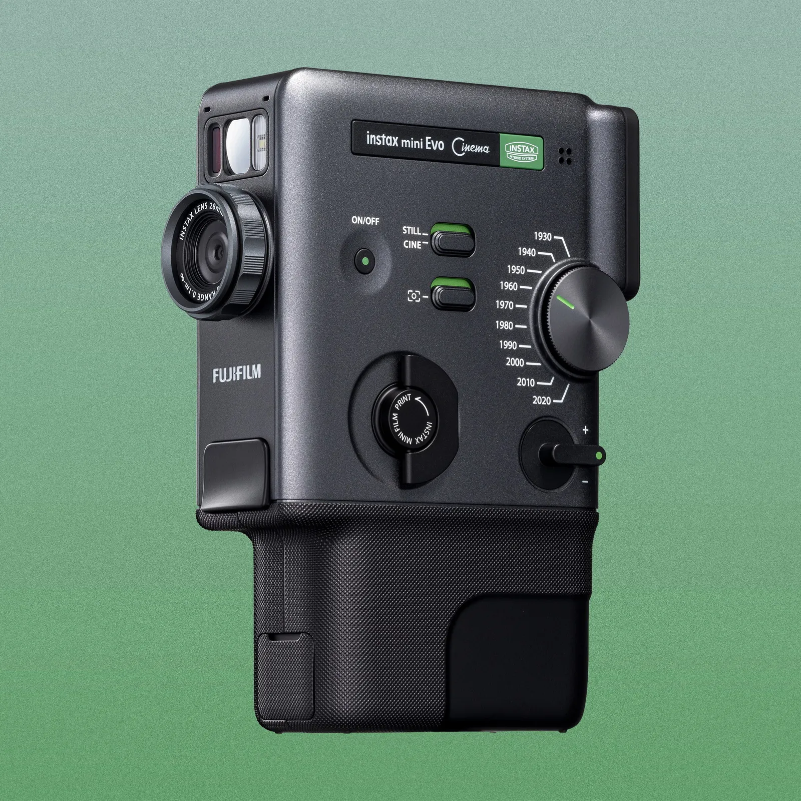 Fujifilm Instax mini Evo hybrid instant camera in dark gray, featuring a front-facing lens, a setting dial, and a manual print lever.